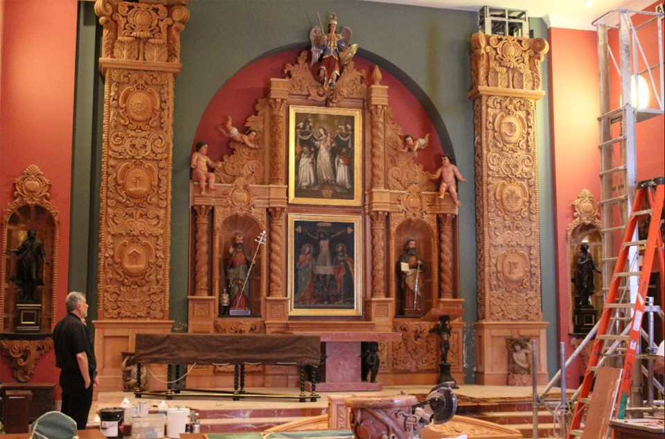 Restored gilded altar with carved figures