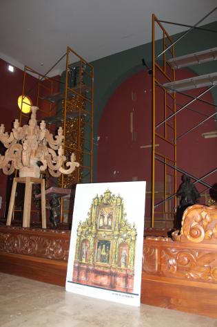 Carved wood candelabra in the restoration studio